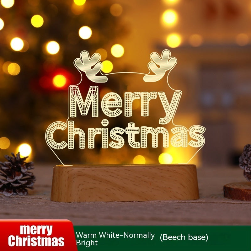 3D acrylic LED Christmas decoration lamp with "Merry Christmas" text and reindeer antlers on wooden base in warm white light